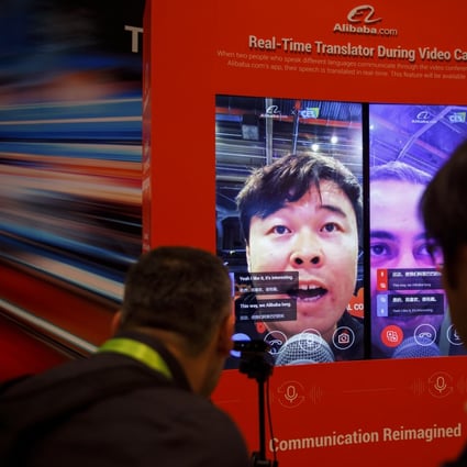 Attendees interact with a real-time translator for video calls at the Alibaba booth during CES 2019 in Las Vegas. Photo: Bloomberg