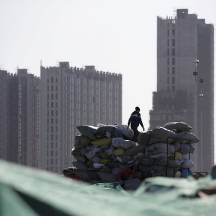Will Beijing’s partial relaxation on price curbs boost flat sales in the property slump? Photo: Reuters