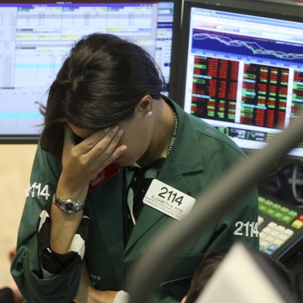 A specialist with Lehman Brothers reacts as the firm slides into bankruptcy in 2008. Photo: AP