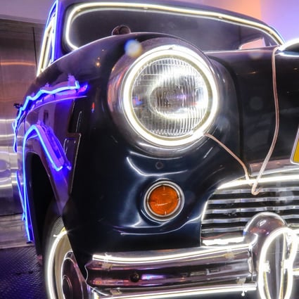 A retro taxi wrapped in neon lights, the work of creative studio Ceekayello, on display at Kong Art Space in Hong Kong’s Central district. Photo: Vivian Yan
