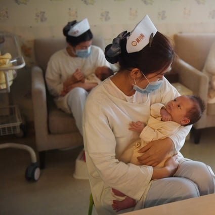 Nurses holding babies at the Xiyuege Centre, or “Lucky Month Home”, in Beijing. Since the late 70s, strict measures in the world's most populous country restricted most couples to only a single offspring with a system of fines for violators and even forced abortions. But concerns over an ageing population, gender imbalances and a shrinking workforce pushed authorities to end the restriction, allowing all couples a second child from January 1 2016. Photo: Agence France-Presse