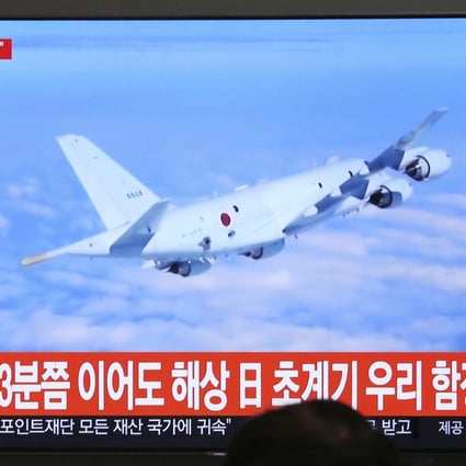 A South Korean news programme showing file footage of a Japanese patrol plane. Photo: AP