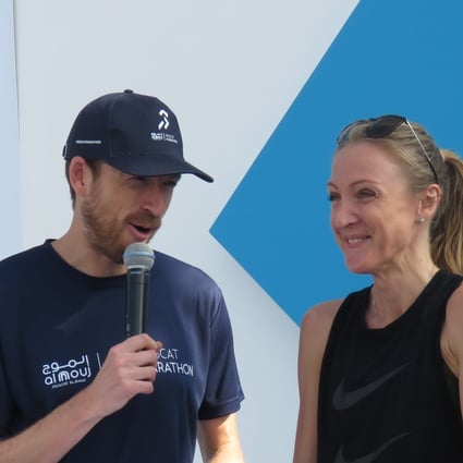 Eoin Flynn interviews Paula Radcliffe at the Muscat Marathon. He quit his desk job and a series of coincidence led him to become the finish line announcer at the UTMB. Photo: Pavel Toropov