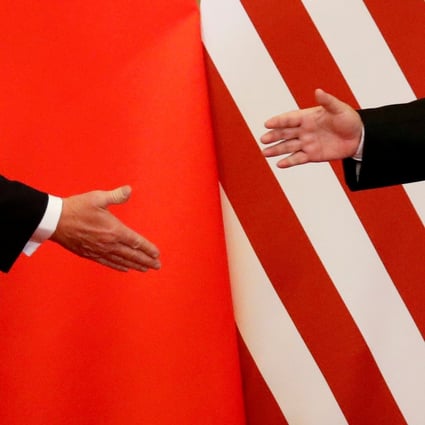 US and Chinese presidents Donald Trump and Xi Jinping reach for a handshake in Beijing on November 9. 2017. Photo: Reuters  FILE PHOTO: U.S. President Donald Trump and China's President Xi Jinping shake hands after making joint statements at the Great Hall of the People in Beijing, China, November 9, 2017. REUTERS/Damir Sagolj/File Photo/File Photo