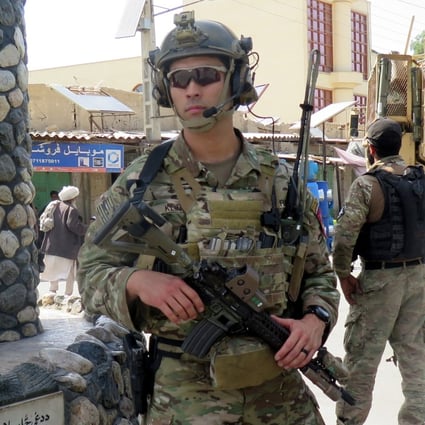 US troops keep watch during an official visit in Farah province, Afghanistan. Photo: Reuters