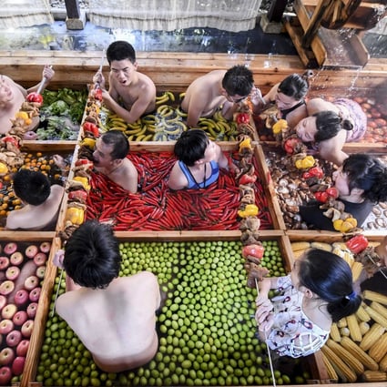 People enjoying a dip in a hotpot-shaped hot spring pool at a hotel in Hangzhou in China’s Zhejiang province. Photo: AFP