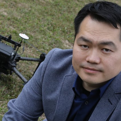 Research leader Dr Zhi Ning with one of the drone models. Photo: Dickson Lee