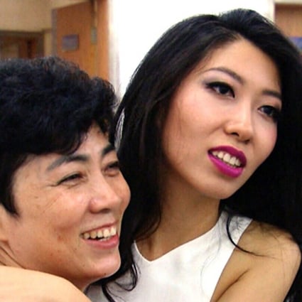 Wanting Qu (right) with her mother, former Harbin City planning official Qu Zhang Mingjie. Photo: CTV