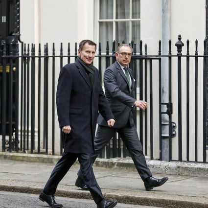 Jeremy Hunt, UK foreign secretary, left, arrives for a weekly meeting of cabinet ministers at number 10 Downing Street in London. Photo: Bloomberg
