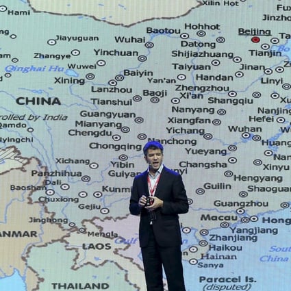 Uber Technologies co-founder Travis Kalanick speaks in front of an electronic board showing a map of China at the Baidu World Conference in Beijing in 2015. The serial entrepreneur now plans to return to China through another start-up, City Storage Systems, which redevelops properties into tech-enabled infrastructure, like kitchens, for the food industry. Photo: Reuters