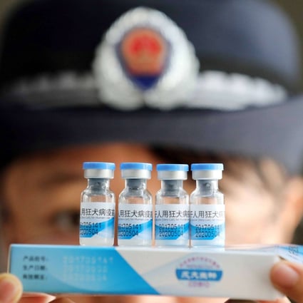 A law enforcement officer checking vaccines in Rongan, China, in July. China’s corruption watchdog on Saturday said it had disciplined more than 80 officials linked to a vaccine scandal last year. Phto: EPA-EFE