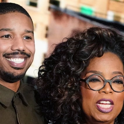 Actor Michael B. Jordan hugs Oprah Winfrey on stage during the taping of her TV show in which he discussed going into therapy after filming Black Panther. Photo: Reuters