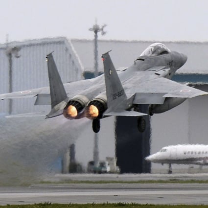 A Japanese F-15 fighter scrambles at the Air Self Defence Force Naha base in Okinawa, Japan. Photo: Reuters