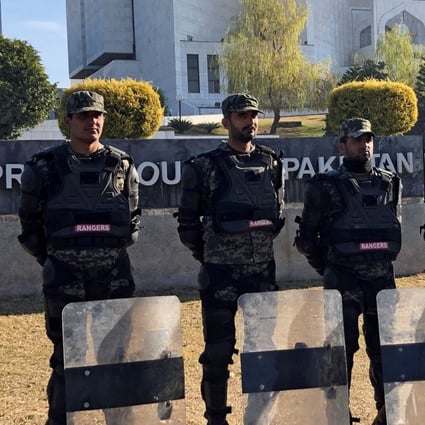 Paramilitary soldiers stand guard outside the Supreme Court building in Islamabad. Photo: Reuters
