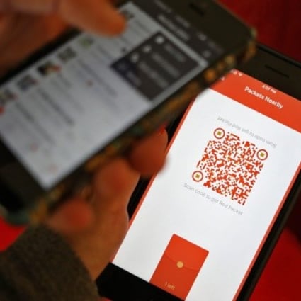 A photo illustration of a WeChat user scanning a QR code to retrieve a digital red envelope on the WeChat app on a mobile phone during the Lunar New Year period in Beijing, China, 30 January 2017. Photo: EPA/STR
