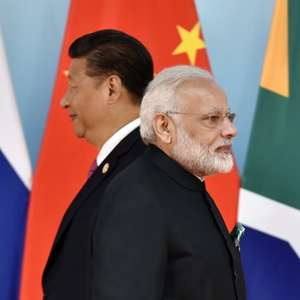 Indian Prime Minister Narendra Modi (right) and Chinese President Xi Jinping (left) attend the group photo session during the BRICS Summit at the Xiamen International Conference and Exhibition Centre in Xiamen on September 4, 2017. Photo: Agence France-Presse