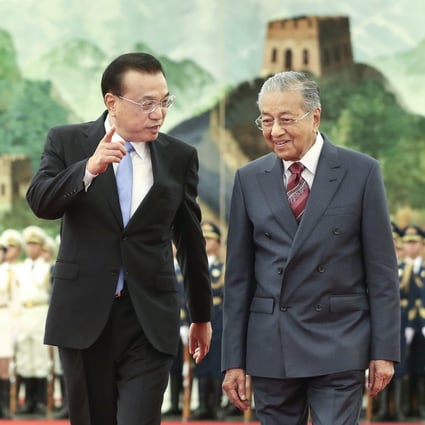 Chinese Premier Li Keqiang welcomes Malaysian Prime Minister Mahathir Mohamad to Beijing on his visit last year. Photo: Xinhua