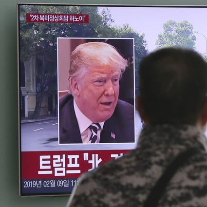 A man watches a TV screen showing images of US President Donald Trump and North Korean leader Kim Jong-un during a news program at the Seoul Railway Station on February 9. Photo: AP