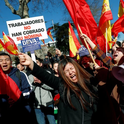 Chinese customers of Spanish bank BBVA protest outside its headquarters in Madrid on Friday. Photo: Reuters