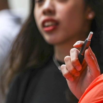 A bill to amend the Smoking Ordinance proposes to subject anyone who brings in, imports, makes, sells, distributes or promotes new smoking products in Hong Kong – including e-cigarettes, heat-not-burn products and herbal cigarettes – to a maximum penalty of six months in jail and a fine of HK$50,000 if convicted. The first reading will take place on February 20. Photo: Edward Wong