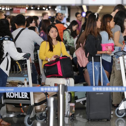 Travellers queue at Hong Kong International Airport to check in for their flight. As a major transit point and popular destination, Hong Kong draws tens of millions of visitors to the city every year, and its travel industry generates and absorbs enormous amounts of data from and about customers. Photo: Dickson Lee
