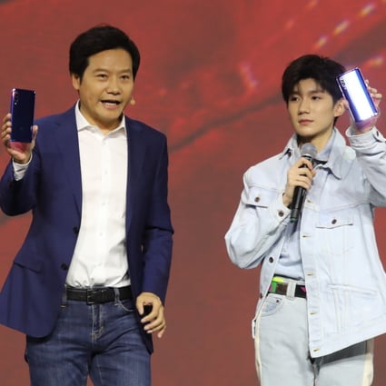 Xiaomi chief executive Lei Jun, left, with brand ambassador Wang Yuan. Photo: Handout