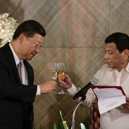 Rodrigo Duterte (right) proposes a toast to Xi Jinping at a state banquet in Manila in November. China invited Duterte to attend the summit during that trip. Photo: AP