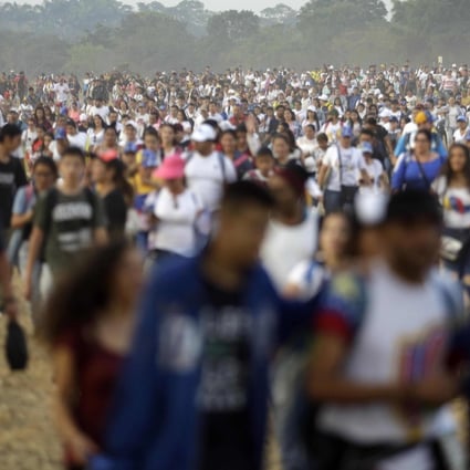 People begin to arrive to the Venezuela Live Aid concert on the Colombian side of the Tienditas International Bridge on the outskirts of Cucuta, Colombia, on the border with Venezuela. Photo: AP Photo