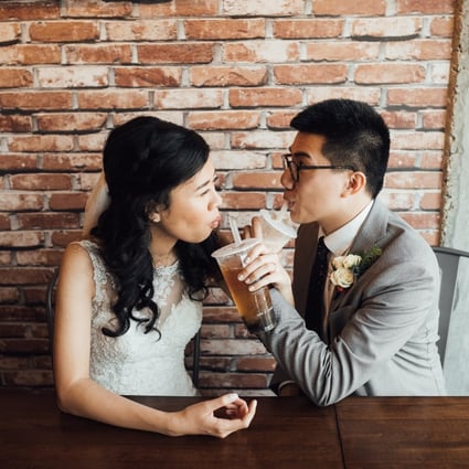 Christopher Cheung enjoys a bubble tea with his wife on his wedding day.