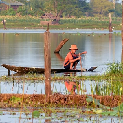 A Cambodian fisherman lays his nets out on Ta Mok Lake in Anlong Veng, Cambodia. Photo: AFP