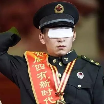 Du Fuguo, who lost his hands and eyes when a bomb exploded during a mine sweeping operation, was honoured by the PLA for his sacrifice in January. Photo: Handout