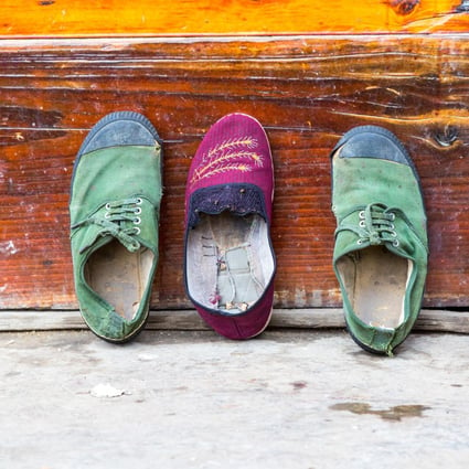 Shoes outside a house in Gejia village, Guizhou province, China. Picture: Alamy