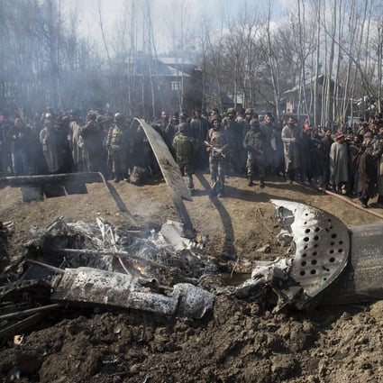 People gather around the wreckage of an Indian aircraft after it crashed about 34km south of Srinagar city in Indian-controlled Kashmir on Wednesday. Photo: Xinhua