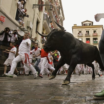 The running of the bulls is shown at the San Fermin fiestas in Pamplona in northern Spain on July 8, 2012. China’s bull market began quickly, raising questions about how long it can last. Photo: Associated Press