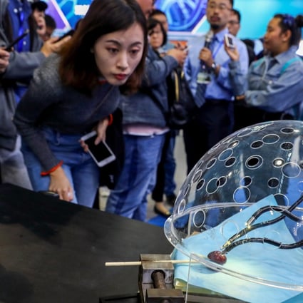 A porotic laparoscopic surgery robot system at a press preview of the 2018 National Mass Innovation and Entrepreneurship Week in Beijing on October 8, 2018. Photo Xinhua