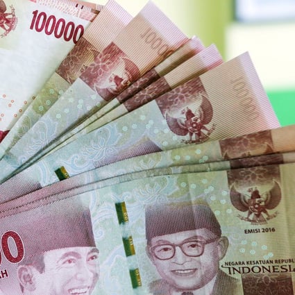 In Indonesia, minimum wages vary by regions, ranging from US$107 in Yogyakarta to US$222 in Papua – so interest quickly results in debts becoming unbearable. Photo: EPA-EFE