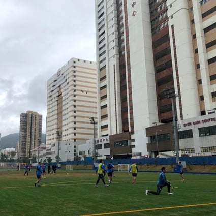 Kitchee players train on the brand-new turf at their training centre in Shek Mun. Photos: Chan Kin-wa