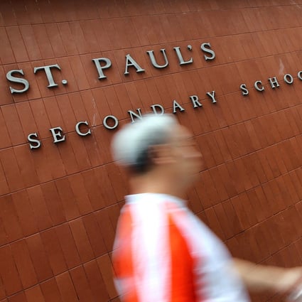 A teacher at St Paul’s Secondary School at Happy Valley called the police when pupils taking photographs at the school gate refused to disperse. Photo: K.Y. Cheng