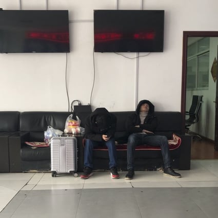 Workers take nap in a job agency near Zhengzhou Foxconn, Henan province. Photo: Cissy Zhou