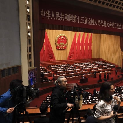 Premier Li Keqiang delivering the work reports at the opening session of the China's National People's Congress at the Great Hall of the People in Beijing. Photo: AP