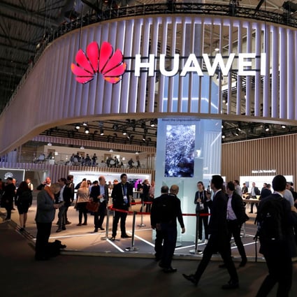 Visitors walk next to Huawei booth at the Mobile World Congress in Barcelona, Spain on February 27. Photo: Reuters