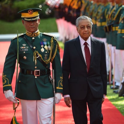Malaysia's Prime Minister Mahathir Mohamad reviews an honour guard during a welcoming ceremony at the Malacanang Palace in Manila. He is in the Philippines for talks with President Rodrigo Duterte. Photo: AFP
