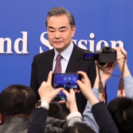 Chinese Foreign Minister Wang Yi arriving at Friday’s press conference in Beijing. Photo: Simon Song