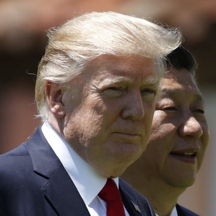 US President Donald Trump, left, and Chinese President Xi Jinping walk together at Mar-a-Lago in Palm Beach, Florida, in this 2017 file photo. Photo: AP