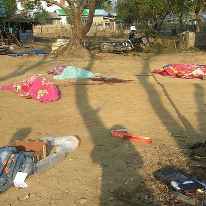 Bodies of policemen, killed in a militant attack, are covered by blankets at the Yoetayoke police station, near Sittwe in Rakhine State. Photo: AFP