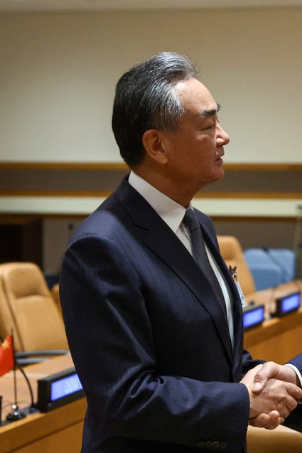 Wang Yi and Sergey Lavrov shake hands ahead of their meeting at the UN in New York. Photo: Reuters
