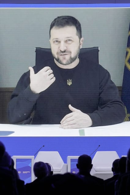 Ukraine President Volodymyr Zelensky talks to participants at the World Economic Forum in Davos via video link on Wednesday. Photo: AP
