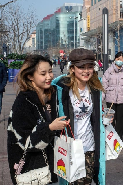 Shoppers in the Wangfujing shopping area in Beijing on February 10. China’s high savings rate and youth unemployment may become stumbling blocks to spending if the economic recovery fails to broaden. Source: Bloomberg