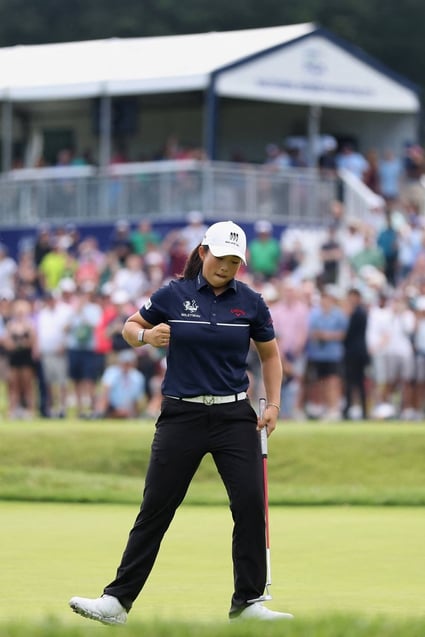 Yin Ruoning celebrates after holing her putt on 18 during the final round of the  KPMG Women’s PGA Championship. Photo: AFP