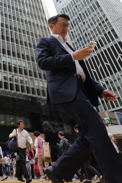 People cross the road in Central on April 11. The government must ensure that incoming enterprises truly benefit the local economy and local talent. Photo: Jelly Tse